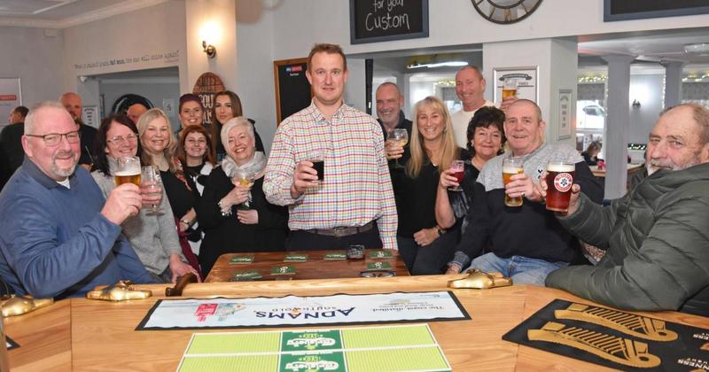 Cheers! Departing pub landlord given a farewell toast by locals