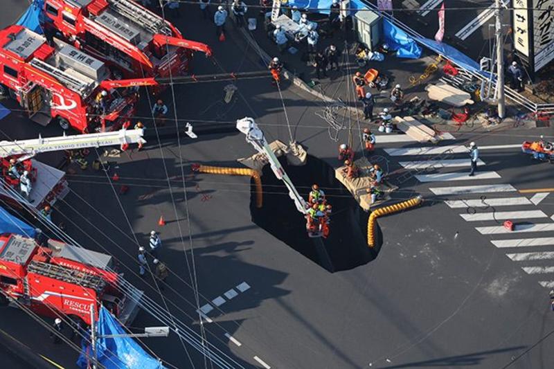 VOX POPULI: Aerial view of sinkhole and neighborhood turns existential