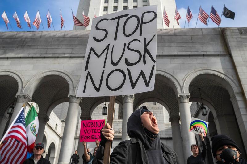 Tesla Faces Protests, Vandalism And Boycott Threats Over Musk’s MAGA-DOGE Rampage