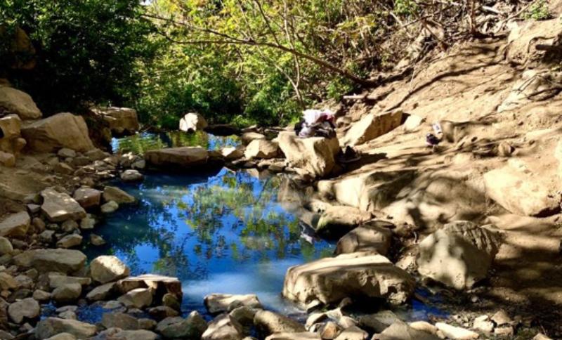 Neighbors angry after tour bus is seen at controversial California hot springs