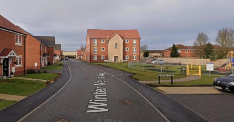 Road blocked for more than two hours after car crashes into parked vehicle