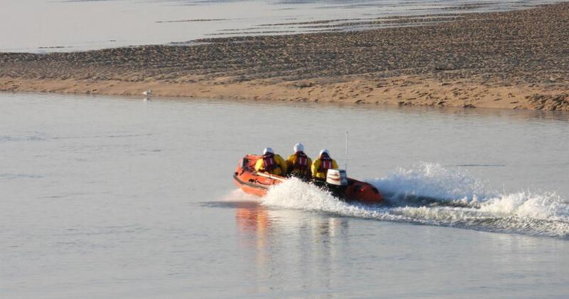 Three people and dog stranded off Norfolk coast